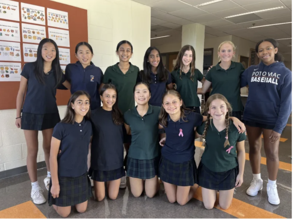 Intermediate School students from the service learning team, including project leaders Lola Burrell and Maddy DenHerder, gather for a picture.
